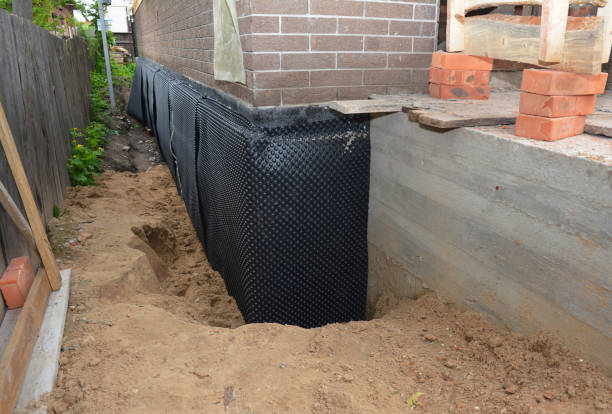 SJ Waterproofing Pros technician performing targeted Exterior Waterproofing assessment in Dayton, KY